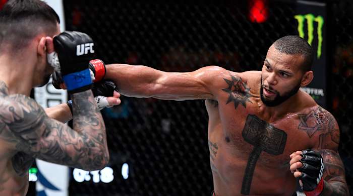 Mar 6, 2021; Las Vegas, NV, USA; Thiago Santos of Brazil punches Aleksandar Rakic of Austria in their light heavyweight fight during the UFC 259 event at UFC APEX on March 06, 2021 in Las Vegas, Nevada.